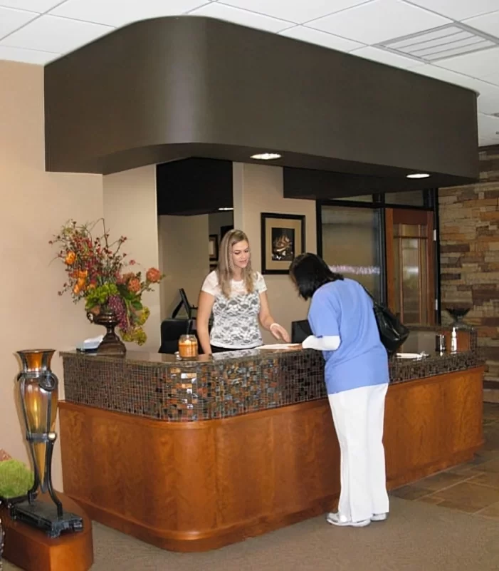 Fort Worth Dental reception desk - friendly staff helping patient check in