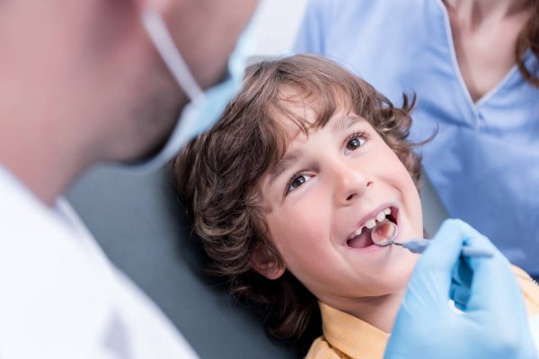 LANAP Laser Gum Disease Treatment - Fort Worth Dental periodontist examining patient for laser gum surgery candidacy